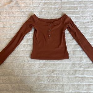 Here is a orange crop top long sleeved from Aeropostale!